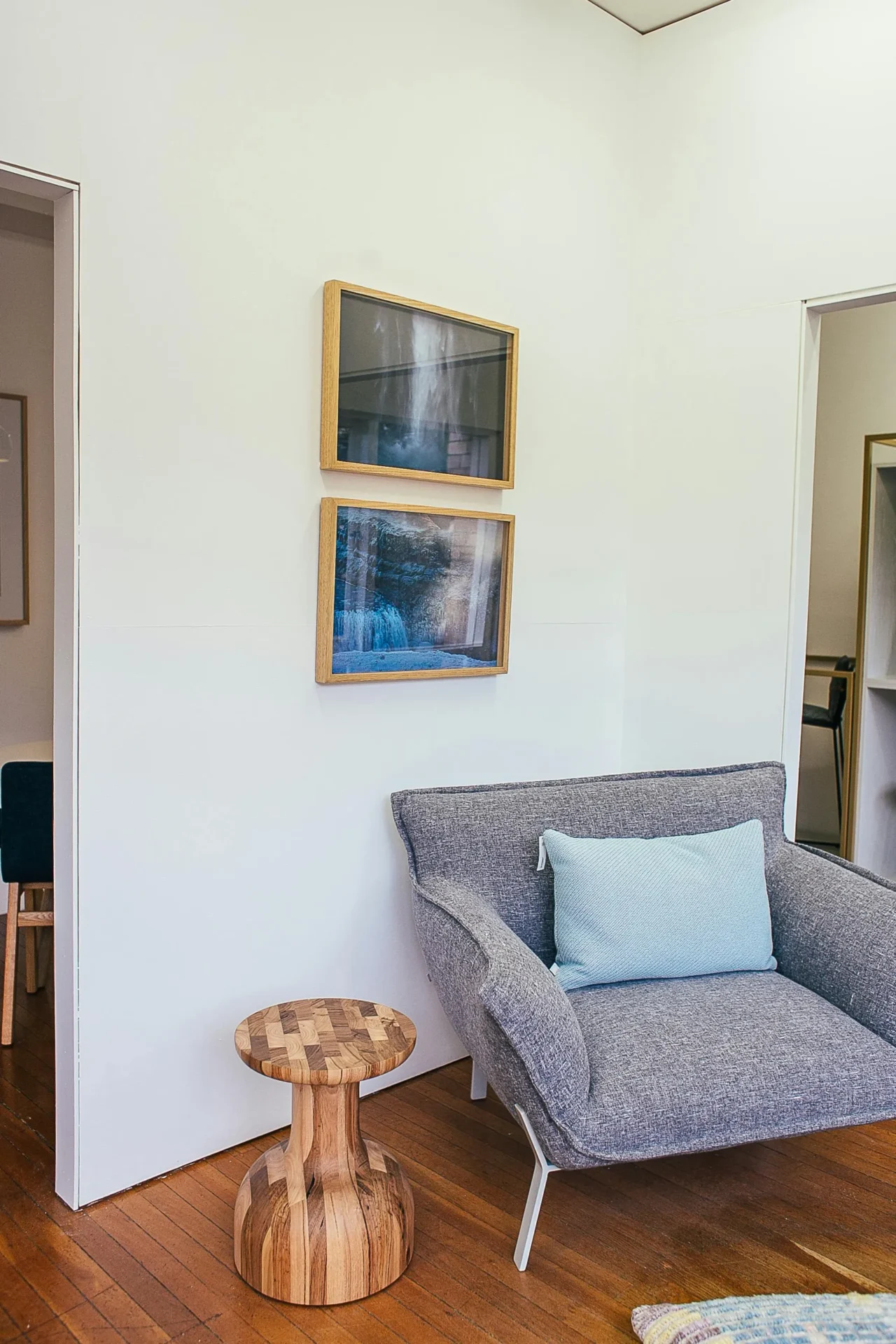 A quiet wall with a small artwork and intentional empty space.