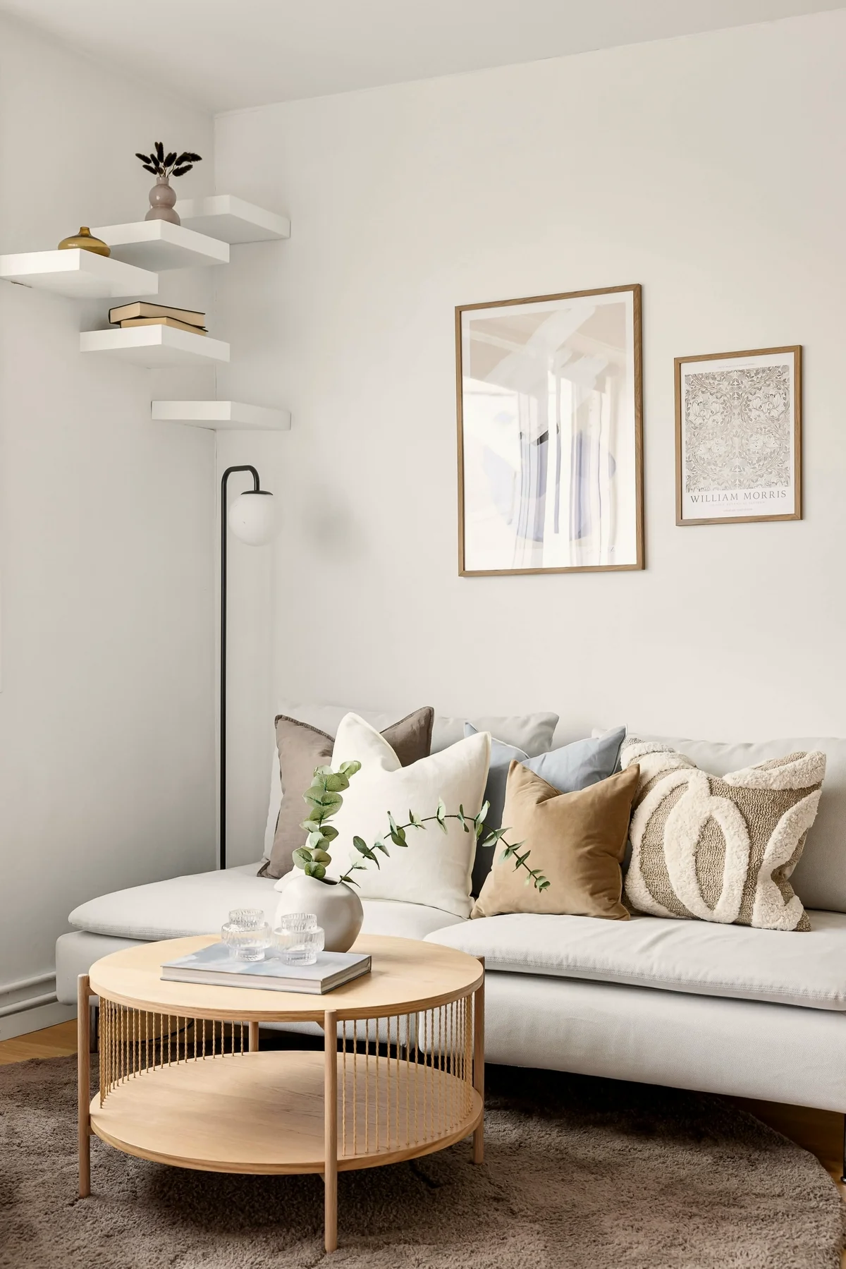 A calm room with framed artwork placed near the natural line of sight.