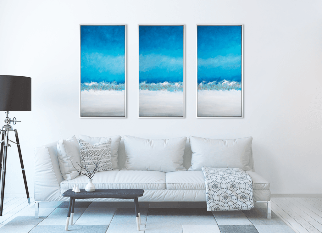 Coastal Horizon original three-panel artwork displayed in a contemporary gray living room.