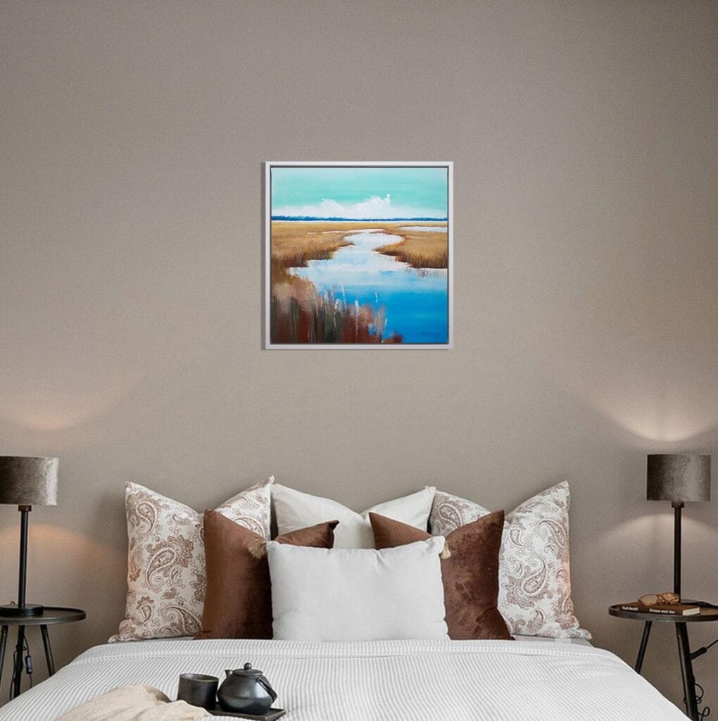 Golden Marsh Path original framed acrylic painting displayed above a bed in a calm neutral bedroom.
