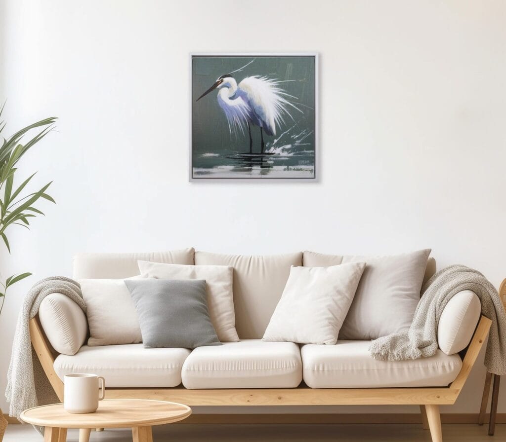 Graceful Egret limited edition bird artwork displayed above a neutral living room sofa by Bonum Art Gallery