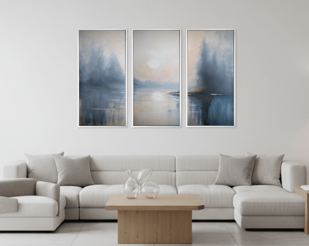 Mists of Serenity original three-panel acrylic artwork displayed above a white sectional sofa in a soft modern living room.