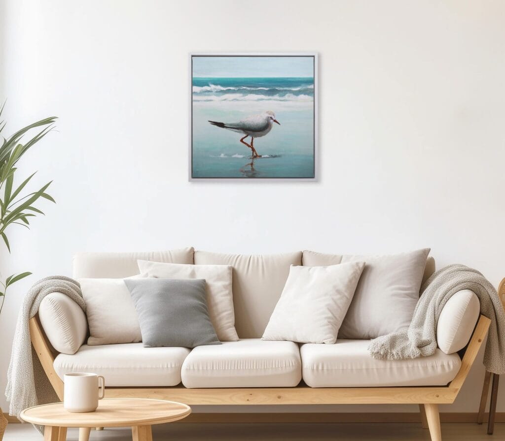 Shoreline Sandpiper I limited edition bird artwork displayed above a neutral living room sofa by Bonum Art Gallery
