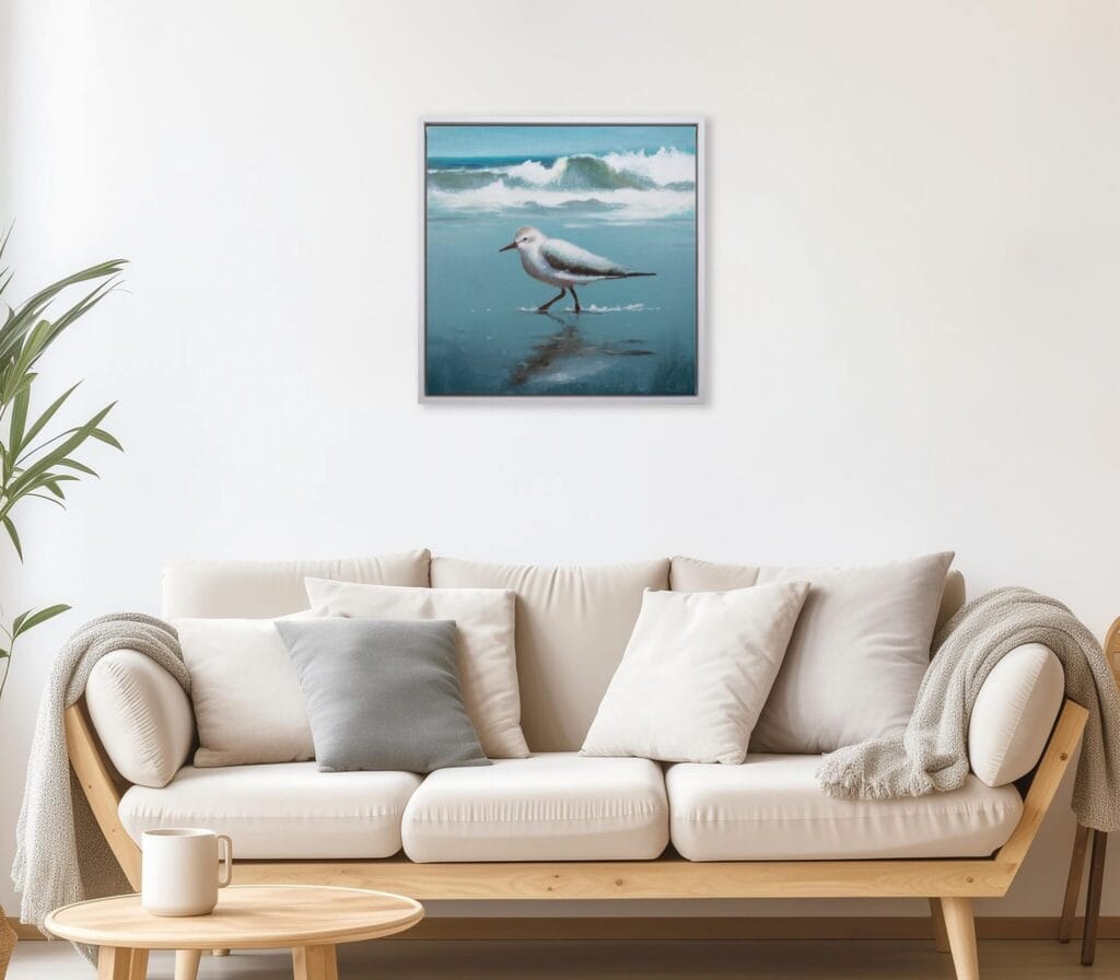 Shoreline Sandpiper II limited edition bird artwork displayed above a neutral living room sofa by Bonum Art Gallery