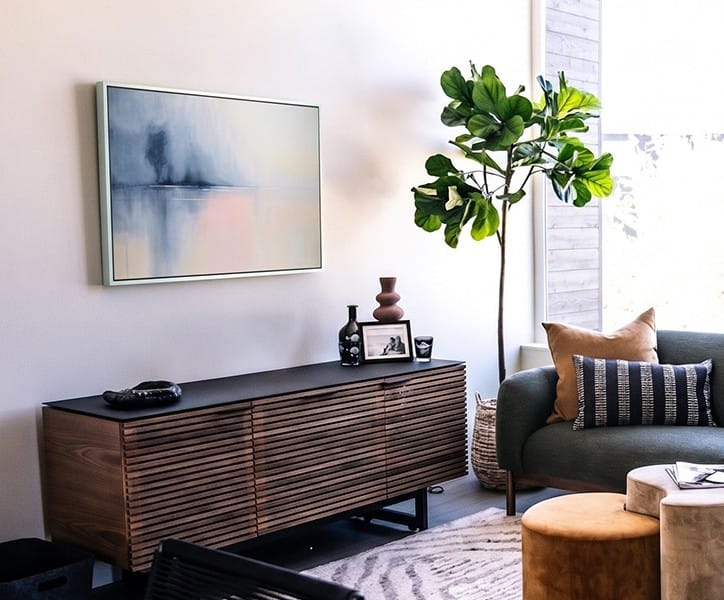 Whispers of Dawn original framed acrylic painting displayed above a console table in a calm contemporary interior.