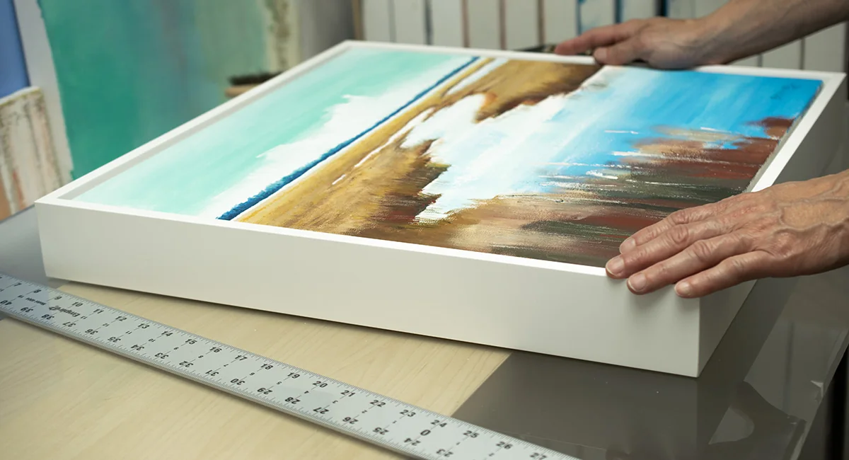 A framed Bonum artwork being reviewed in the studio