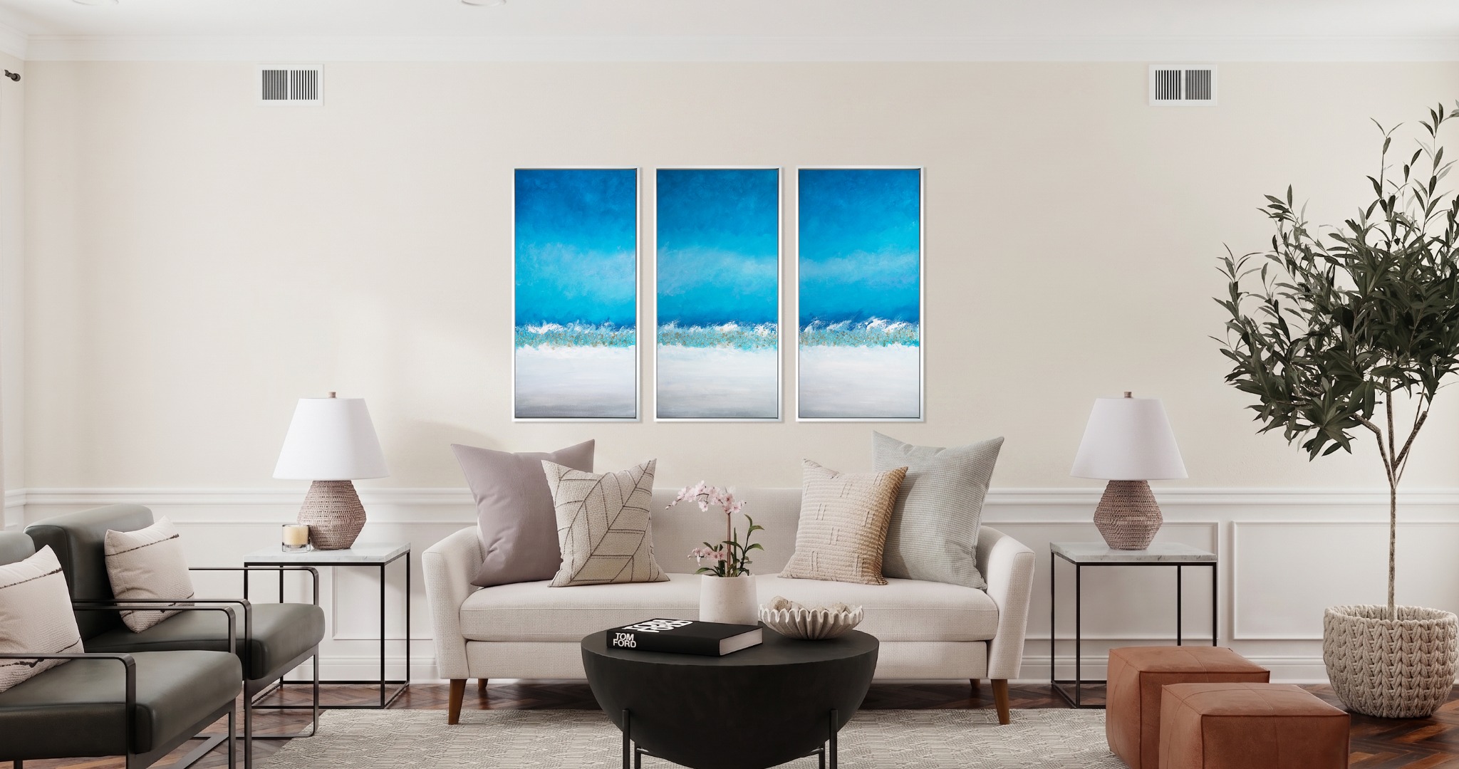 A bright living room with a Bonum Art Gallery triptych above the sofa